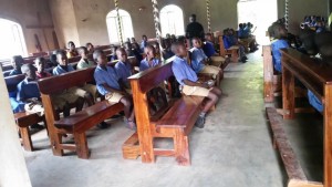 pupils seated on the donated pews